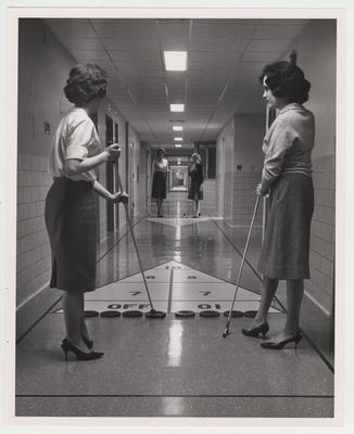 Women play shuffle board in a hallway of the Medical Center; Lexington Herald - Leader staff photo