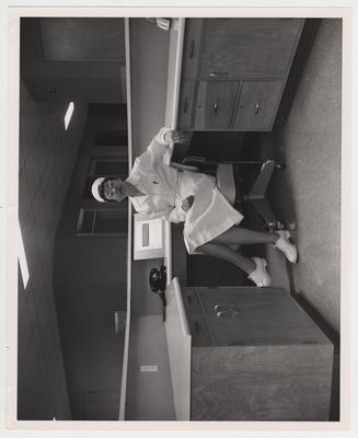 A female nurse sits at a desk; Lexington Herald - Leader staff photo