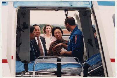 An unidentified man talks to visitors from Shandong Ji'Den, China, about medical helicopter procedures