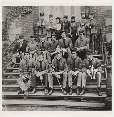 Commissioned officers on the steps of a building at Kentucky State College.  Sponsors of the day wore sailor hats and carried sabers