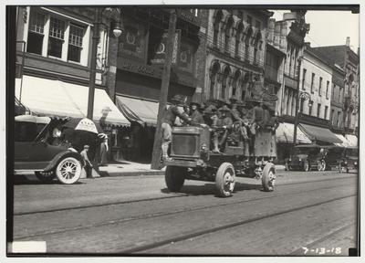 University of Kentucky military technical training during World War I.  Cadets riding in a truck down the street