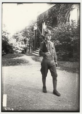 University of Kentucky military technical training during World War I.  Cadet holding a rifle