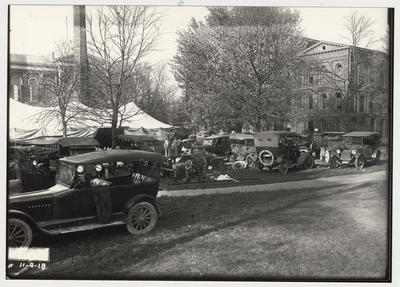 University of Kentucky military training during World War I.  Cars parked behind the Administration building