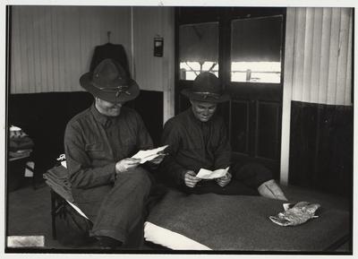 University of Kentucky military technical training during World War I.  Two cadets reading letters in their barracks
