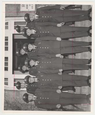 Distinguished Military Students (1962-1963).  On the front row from the left: Carpenter, Conner, Button, Fitzpatrick, Klopp, and Tulkoff.  Second row from the left: Lynd, Ross, Cox, and and unknown cadet.  They are standing in front of Buell Armory