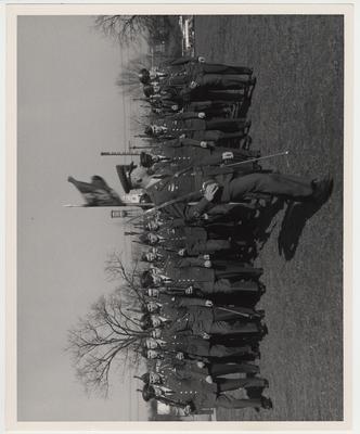 Army Reserve Officers Training Corps learning rifle drill and formation marching.  Memorial Hall is in the background