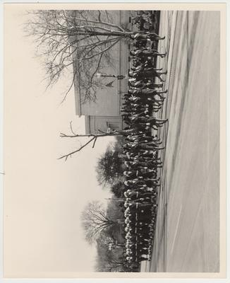 The University of Kentucky Air Force Reserve Officers Training Corps marching in the Inaugural Parade for John F. Kennedy in Washington D. C. They are in front of the National Art Gallery