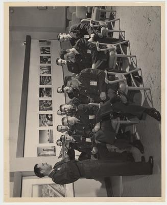 Air Force Reserve Officers Training Corps cadets visit a research center.  Lieutenant Colonel T. B. Nichols is standing