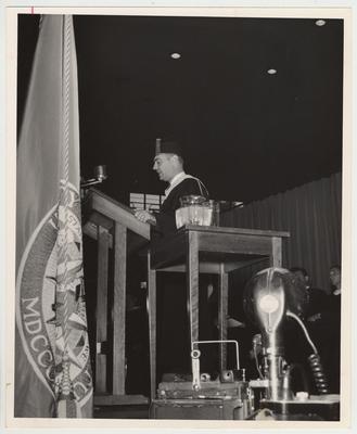 President Frank Dickey is standing at the podium, speaking at his inauguration ceremonies