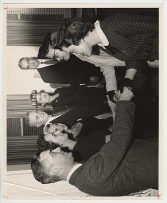 President Frank Dickey is standing in a group with his wife, Betty