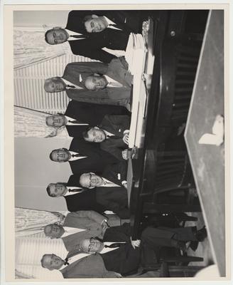 Seated third from the right is Bert Combs (Governor from 1959-1963); seated on the far right is Walter Hillenmeyer; third from the right standing is Dr. Thomas Clark, Professor of History.  All other nine men are unidentified