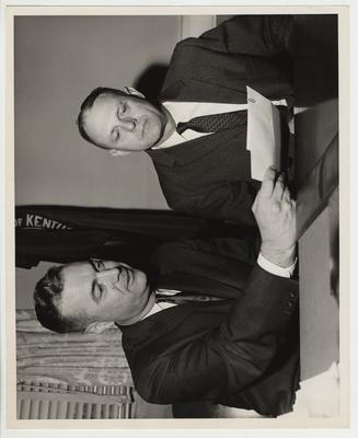 President Frank Dickey (right) and Doctor Roscoe C. Kash (left) looking at the gift Doctor Kash gave the University of Kentucky for the Scholarship Fund.  Doctor Roscoe C. Kash is an alumnus of the class of 1925