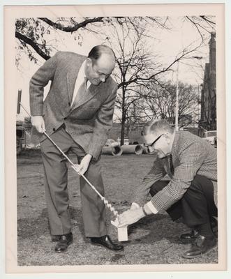 Doctor Albert Kirwan (right) with an unidentified man taking soil samples