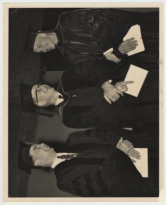 From left to right: Thomas A. Spragens, president of Centre College; Albert Kirwan, president of the University of Kentucky; William R. Willard, vice president of the University of Kentucky Medical Center.  They are wearing commencement robes