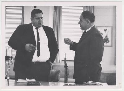 President John Oswald (right) in a meeting with Martin Pedigo (left) of the Henderson Community College