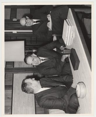 Seated from left to right: Mr. Foley, Assistant Secretary of Commerce; president John Oswald; Arnold DeWalt Albright, University of Kentucky Vice President of Administration