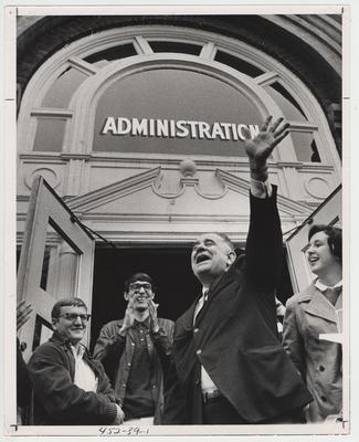 President Oswald (center with hand raised) with student protesters in front of the Administration Building.  This photo is in the 1969 Kentuckian on page 39