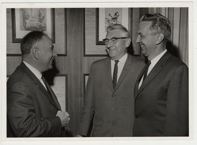 President John Oswald (far left) greets Sam Vandermeir (center) and G. W. Schneider (far right)