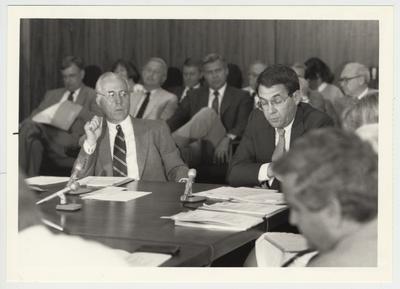 President Roselle (right) seated next to Bob McCowan (left), chairman of the Board, at the Board of Trustees meeting