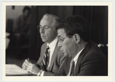 President Roselle (right) seated next to Bob McCowan (left), Chairman of the Board, at a Board of Trustees meeting
