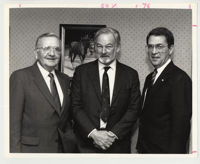 President Roselle (right) is standing with two unidentified men.  This photo is related to the Gluck Equine Research Center