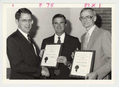 President Roselle (left) presenting a certificate of appreciation to Mr. Brock (center) and Mr. Walton (right)