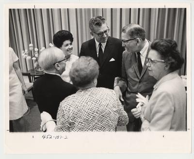 A reception for the introduction of Doctor Singletary (third from right, standing next to his wife Gloria) to the University Community as the new University President in 1969.  This photo is in the 1969 Kentuckian on page 137