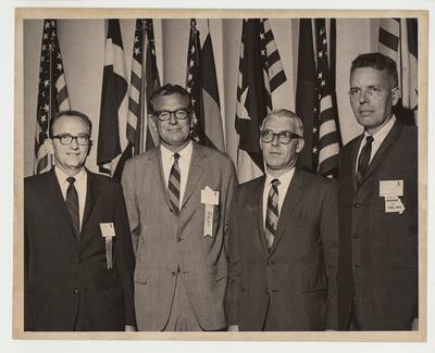 The University of Kentucky hosted 1970 Association of American Educators and Administrators convention.  From left to right: unidentified man, President Singletary, unidentified man, and Harold F. Briemyer of the University of Missouri