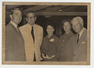 Five people standing together.  From the left:  Unidentified man, President Singletary, Gloria Singletary, unidentified woman, and unidentified man