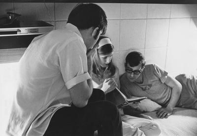 Two men and a woman are studying in the Graduate Co-ed Dorms in the Kirwan-Blanding Complex in 1969. This photo appears first on page 204 of the 1969 
