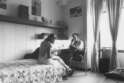Two unidentified female students are studying in a dorm room of the Kirwan-Blanding Complex
