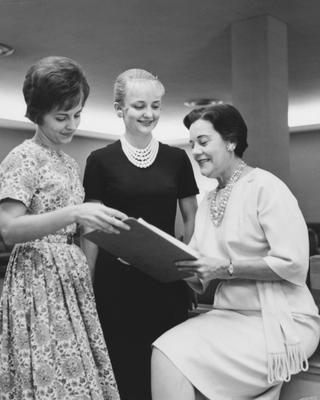 From left to right: Miss Nancy Merle Hart, Miss Dixie Evans, and Mrs. Majorie Nelson are looking at a paper in Blazer Hall. Received October 9, 1962 from Public Relations