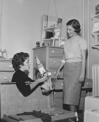 Suzanne Freed (left) and Margaret Futwell (right) are unpacking in a dorm room