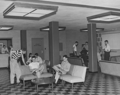 Unidentified men socializing in a men's dorm