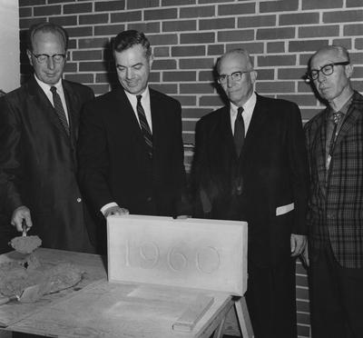The cornerstone of Haggin Hall/ The rites are about to be performed at the dedication on September 16, 1960. From left to right: Dr.  Leslie L. Martin, President Frank Dickey, Dr. Frank D. Peterson and John F. Wilson (architect). Received September 16,  1960 from Public Relations
