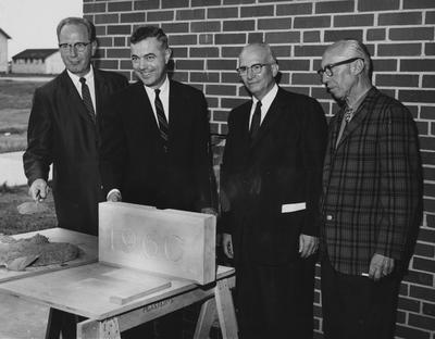 The cornerstone of Haggin Hall/ The rites are about to be performed at the dedication on September 16, 1960. From left to right: Dr.  Leslie L. Martin, President Frank Dickey, Dr. Frank D. Peterson and John F. Wilson (architect)