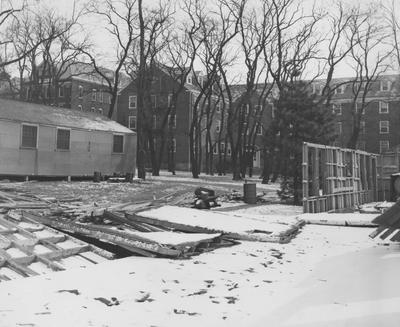 The temporary barracks that had been used to house women students since 1947 are being torn down for the construction of Holmes Hall to begin in early 1957, and will house 200 students