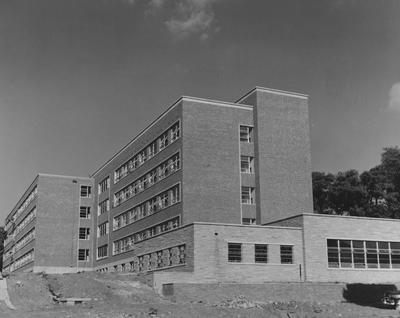 Construction of Holmes Hall began on June 27, 1956, a woman's dormitory which was dedicated on May 25, 1956 for Sarah B. Holmes. Received September of 1957 from Public Relations
