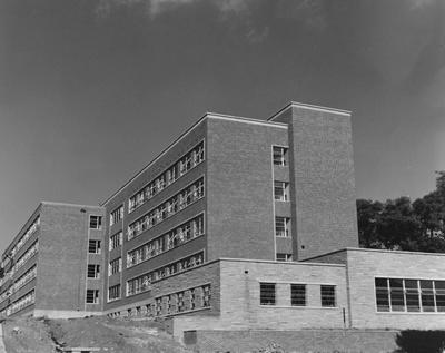 Construction of Holmes Hall, a woman's dormitory, is near completion. It was dedicated on May 25, 1956 for Sarah B. Holmes