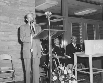 Dean Sarah Bennett Holmes (second from right), Dr. William V. Gardner of First Presbyterian Church (far right) and President Frank Dickey (third from right) are listening to Frank Peterson speaking at the dedication of Holmes Hall on May 25, 1958. Received May 25, 1958 from Public Relations