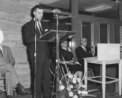 Dean Sarah Bennett Holmes (second from right) and Dr. William V. Gardner of First Presbyterian Church (far right), are listening to President Frank Dickey speaking at the dedication of Holmes Hall on May 25, 1958. Received May 25, 1958 from Public Relations