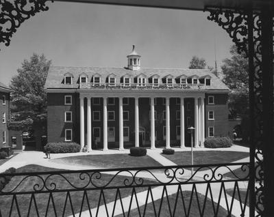 Unidentified students are near Kinkead Hall, a men's dormitory. Kinkead Hall was built in 1929 and was named after William B. Kinkead