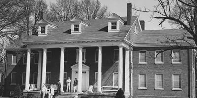 Five unidentified men are in front of the Delta Tau Delta house. Received April 15, 1957 from Public Relations