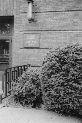Two signs on the side of the Funkhouser building denoting W. R. Allen Zoology Museum. The Funkhouser building was built in 1940 and named after William D. Funkhouser