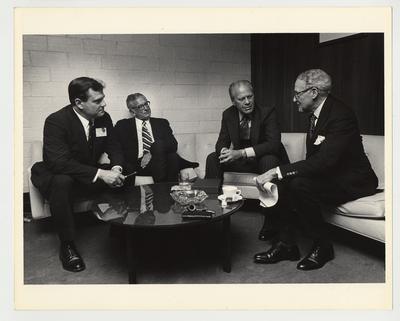 From the left:  Vince Davis; President Singletary; Gerald Ford, former President of the United States; and John Sherman Cooper, United States Senator.  The men are sitting in conversation before a seminar sponsored by the Patterson School of Diplomacy which was held in Memorial Coliseum