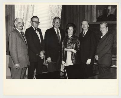 President Singletary (third from the left) is standing with five unidentified people