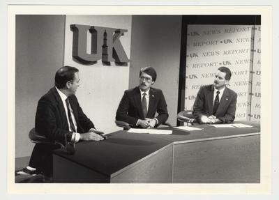 A UK Television News Program.  From the left:  President Charles Wethington, unidentified man, and Carl Nathe