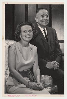 President Oswald and his wife Rosanel are seated on a chair