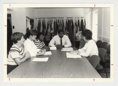 The Student Committee of Self Study are meeting and sitting around a table.  From the left:  Suzi Kifer, Karla Howell, Michele Lee, Victor Hazard, Angene Wilson, and Mary Brinkman