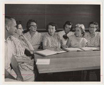 Kenney Harper of Midway Jr. College (third from left), Elizabeth Ragland (third from right), and five unidentified teachers are at a continuing education seminar at the University of Kentucky